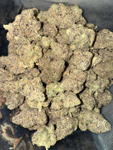 Gush Mintz cannabis buds showcasing dense purple and green hues, ideal for relaxation and creativity. Buy THCA flower online.
